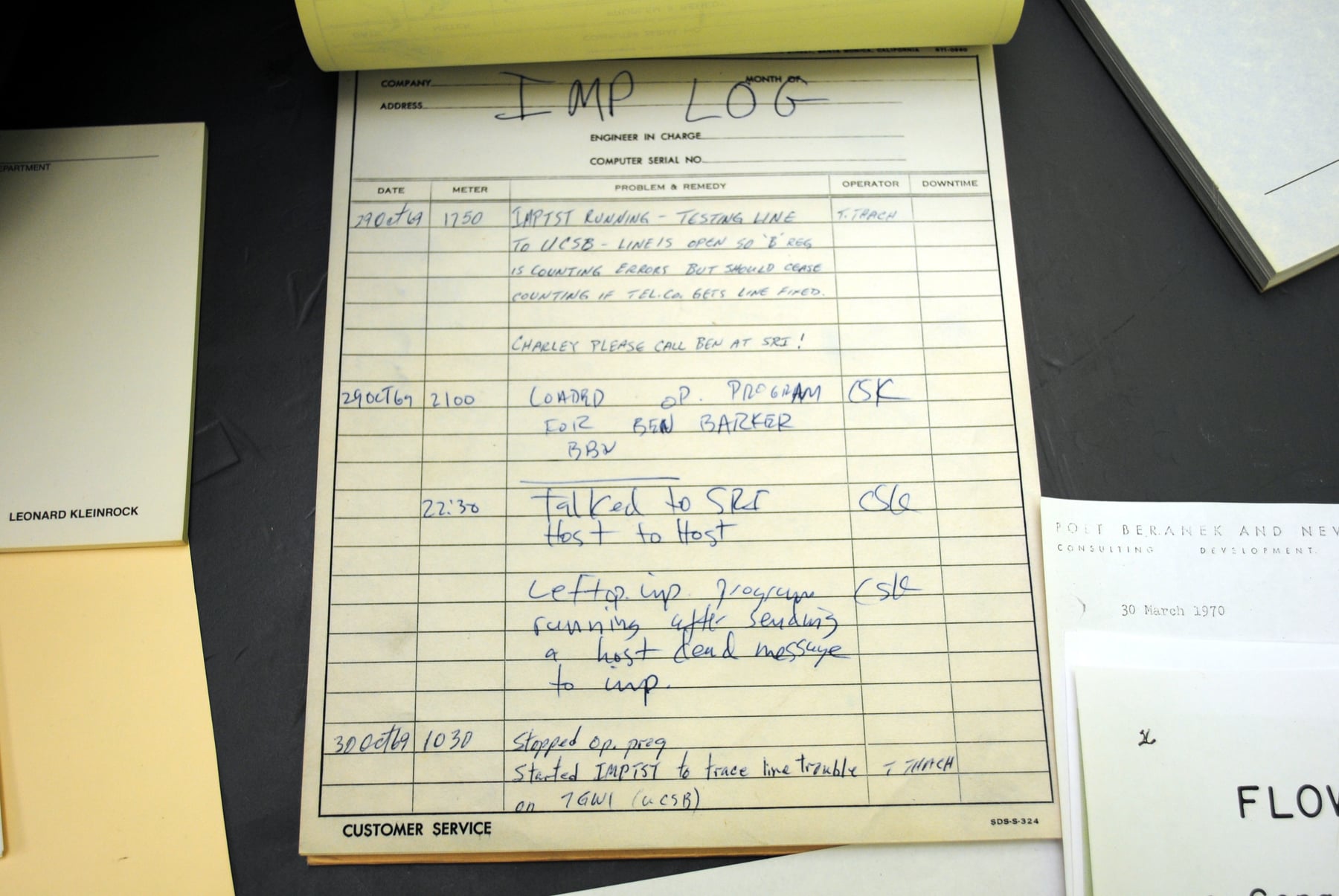 Photograph of the original handwritten UCLA IMP log with a 29 October 1969 entry at 22:30 recording communication with Stanford Research Institute.