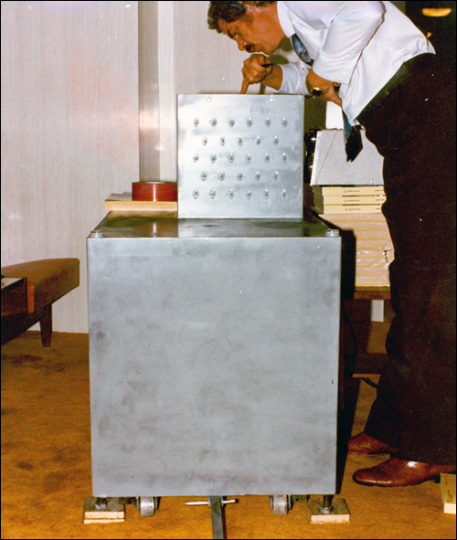 An investigator examining the large metal casing of the bomb placed inside Harvey's Resort Hotel and Casino in August 1980